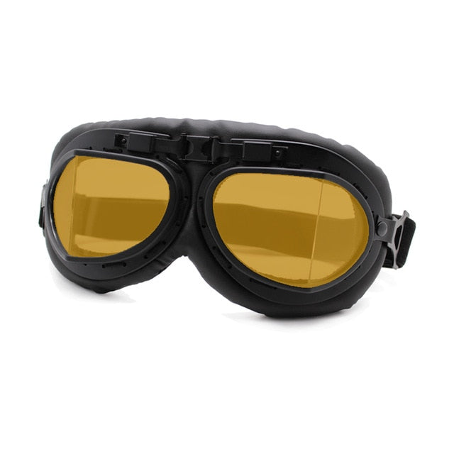 retro motorcycle goggles yellow lense on black metallic frame black leather backing